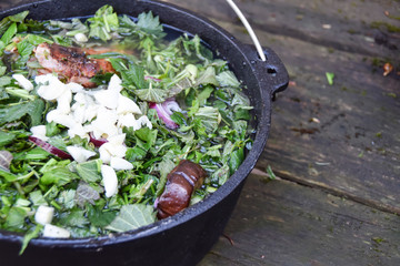 food on a hike in a cauldron green soup