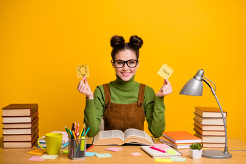 Photo of pretty librarian lady worker fond of reading love her job hold two paper cards creative...
