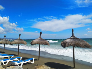 beach with umbrellas