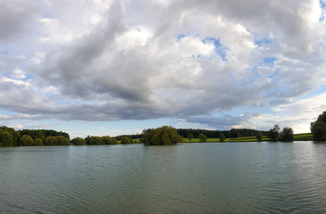 scenic panorama view of natural landscape under a cloudy sky