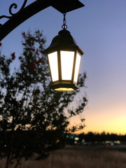 Fototapeta na wymiar Retro-style street lamp during sunset