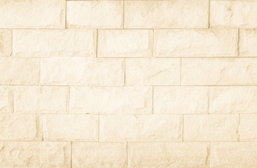 Empty Background of wide cream brick wall texture. Brown brick wall texture background in room at subway. Brickwork stonework interior, rock old concrete grid uneven horizontal architecture wallpaper.