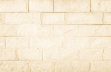 Obraz premium Empty Background of wide cream brick wall texture. Brown brick wall texture background in room at subway. Brickwork stonework interior, rock old concrete grid uneven horizontal architecture wallpaper.