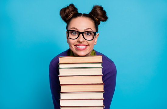 Photo Of Pretty Student Lady Two Funny Buns Leaning Head Chin Books Pile Diligent Pupil Visit Library Fond Of Reading Wear Shirt Pullover Specs Isolated Blue Color Background