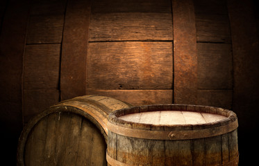Wooden barrel on a table and textured background