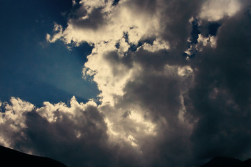 Dark sky and a sharp black cloud before the rain.