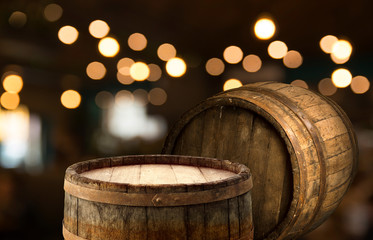 Wooden barrel on a table and textured background