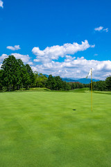 Golf Course with beautiful green field. Golf course with a rich green turf beautiful scenery.