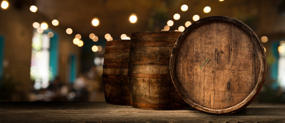 Wooden barrel on a table and textured background