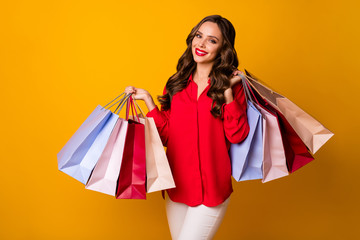 Photo of attractive pretty business lady hold carry many packs addicted shopper sale final season wear red office shirt white trousers isolated yellow vibrant color background