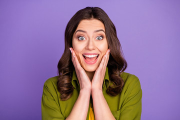 Portrait of astonished crazy funky girl hear incredible black friday bargain news impressed shout touch hands face wear good look clothes isolated over violet color background