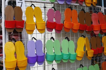 Traditional wooden slippers at a market stall
