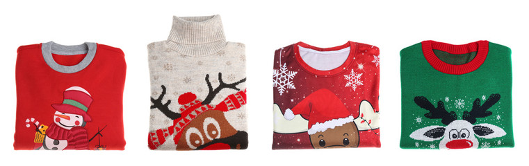 Set of folded Christmas sweaters on white background. Banner design