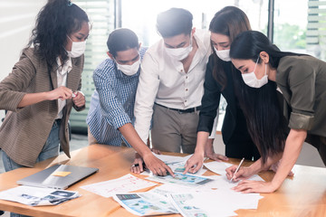 Five business people meeting while wearing flu mask in office for new normal life style