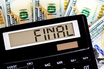 Calculator with text FINAL on the dollars. Business, finance conceptual.