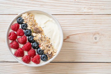 homemade yogurt bowl with raspberry, blueberry and granola
