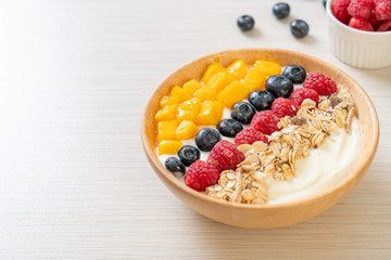 homemade yogurt bowl with raspberry, blueberry, mango and granola