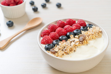 homemade yogurt bowl with raspberry, blueberry and granola