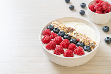 homemade yogurt bowl with raspberry, blueberry and granola