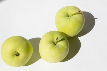 fresh green bio organic apples on white background autumn seasonal garden harvest 