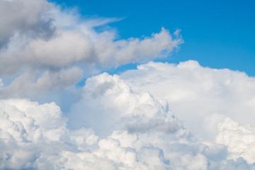 white cumulus clouds in the blue sky