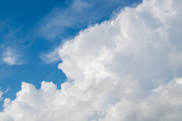 Naklejka na ściany i meble white cumulus clouds in the blue sky