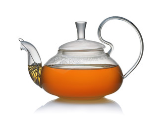 Side view of glass teapot full of fresh tea