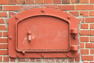 red brick wall with door