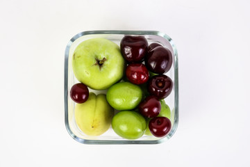 colorful fruits  in a glass bowl top view