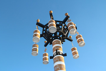 The lamppost is hollowed out with the motif of “Tashi Delek”, which means "good luck" in Tibetan on the Jokhang Temple Square, Lhasa, Tibet