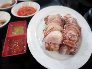 Korean food boiled and cooked in the sauce, (Jokbal). Korean Traditional Food Pork Feet.