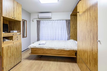 Single bed in old style small bedroom at apartment