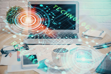 Double exposure of table with computer on background and data theme drawing. Concept of innovation.