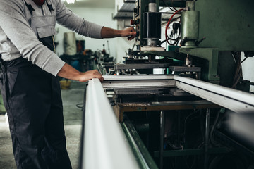 closeup of worker making pvc windows