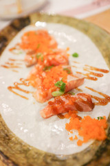Salmon and sauce on white plate