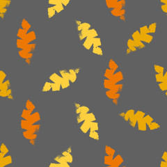 Mono print style scattered leaves seamless vector pattern background. Textured cut out yellow, orange foliage on brown backdrop. Hand crafted painterly design. All over print for fall products