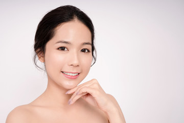 Beautiful Asian woman with clean face on white background