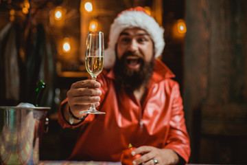 Santa with beard holds glass of champagne. Ready to celebrate. Santa claus - bearded hipster. Christmas santa wishes merry christmas.