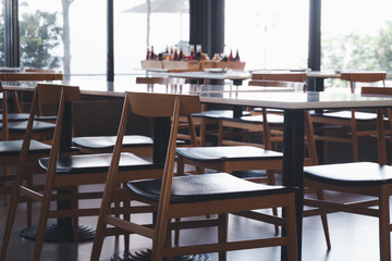 Empty Table row  in restaurant. Table and row in Cafe and restaurant interior.