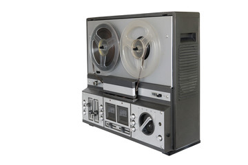 Stereo tape deck recorder player with reels on background.