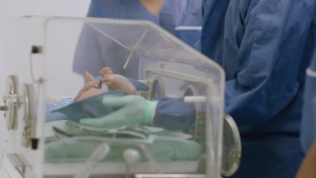 doctors practice with baby dummy