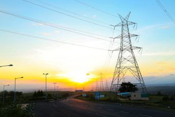 high-voltage power lines at sunset,high voltage electric transmission tower