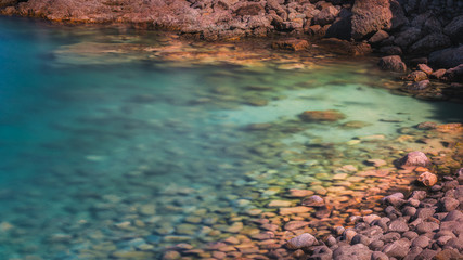 Green Sea Water And Rocks on italian coast