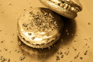 Golden cookies on a gold background.