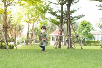 3 brothers are running and playing in the garden.