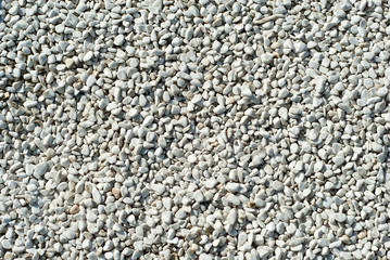 Drainage systems from small pebbles. Garden drainage for plants and trees. White stones for roads and flower beds.