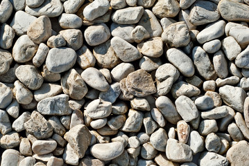 Drainage systems from small pebbles. Garden drainage for plants and trees. Yellow stones for roads and flower beds.