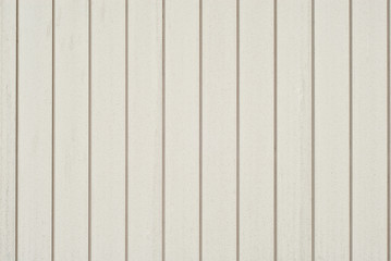 Wall texture with striped paneling. White lining close up.