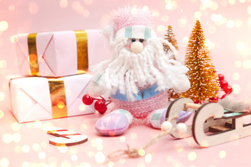 Christmas composition, gifts on pastel pink background, copy space