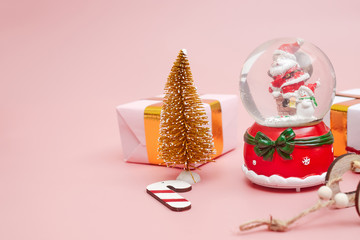 Christmas composition, gifts on pastel pink background, copy space